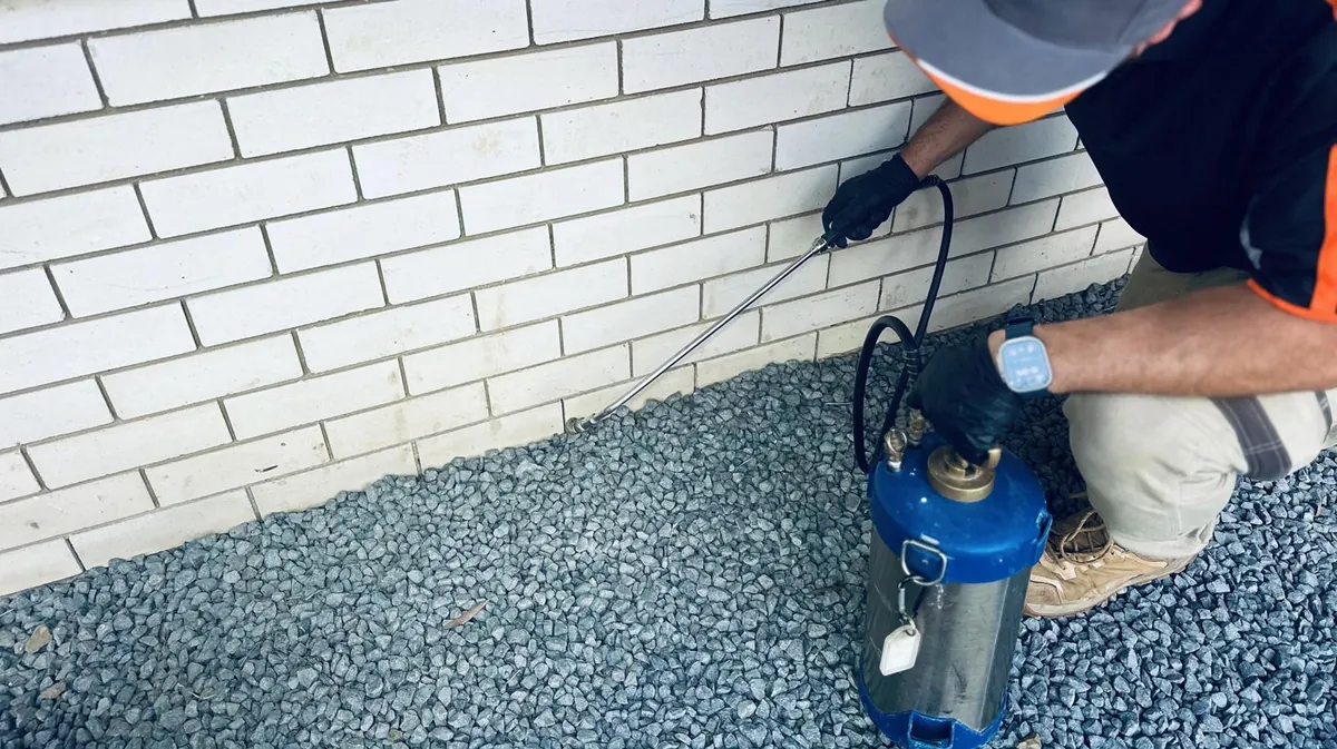 Rapidkil technician treating the external perimeter of a brick home